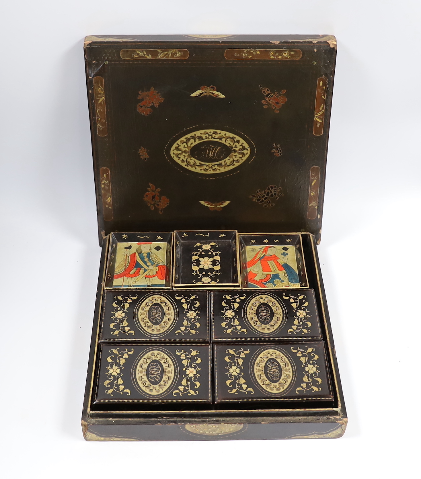 A mid 19th century Chinese export lacquer games box, containing mother of pearl counters